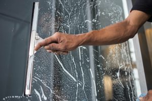 Cleaning windows with a squeegee